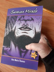 Swansea Miracle book in hand